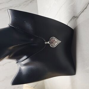 Brighton heart necklace silver plated and leather cord.
